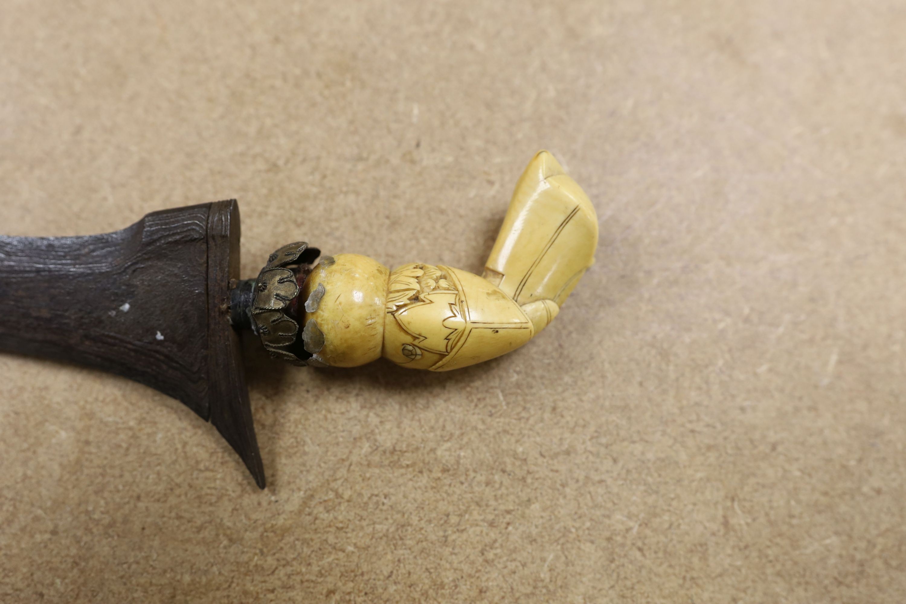 A 19th century ivory handled Kris, 40 cms long.